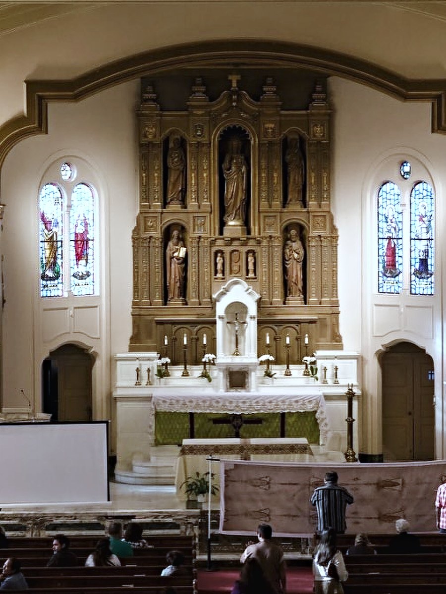 A full-size replica of the Shroud of Turin standing in the hall at St. Monica.